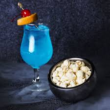 Black And Blue Drink 10 Popcorn And Drink Pairings For Whatever Movie You Re Feeling Blue Lagoon Cocktail White Cheddar Popcorn Drinks