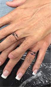 60 Romantic Ring Finger Tattoo Ideas Wedding Finger Tattoos Tattoo Wedding Rings Wedding Band Tattoo