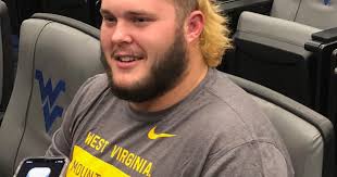 Mullet in place, WVU offensive lineman Josh Sills ready to cut through  defensive lines