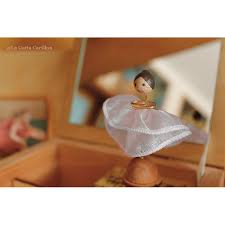 Rectangular wooden musical jewelry box with a figurines inside of box. Custom Musical Jewelry Box Wooden Music Box With Custom Decoration Dedication And Melody