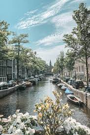the prettiest canals in amsterdam netherlands to vogue or bust travel aesthetic beautiful places to travel places to travel
