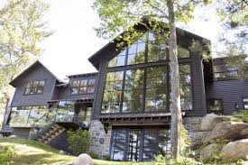 This country house has an arch drive through, arch front door, a brick exterior and surrounded with trees giving an elegant feel to the house. 28 House Exterior Design Ideas Best Home Exteriors