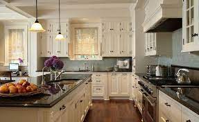 Cream kitchen cabinets with black countertops. Farmhouse Inspiration Ivory Kitchen Home Kitchens Ivory Kitchen Cabinets