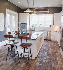 6 Brick Kitchen Floor Ideas We Re Currently Obsessing Over Hunker Brick Floor Kitchen Brick Kitchen Kitchen Flooring