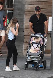 The afl legend revealed his wife, natalie crocker is three months pregnant with their first child. Afl Star Adam Goodes And His Wife Natalie Croker Enjoy A Morning Stroll In Bondi With Their Daughter Daily Mail Online