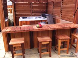 They wanted a cedar hot tub but didn't want to purchase a kit. Inexpensive Diy Outdoor Hot Tub Enclosure With Bar And Louvered Panels For Extra Controlled Privacy Photo Courtes Hot Tub Outdoor Hot Tub Patio Hot Tub Gazebo