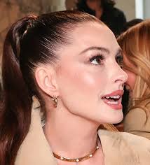 How did Anna Hathaway had a face/neck lift but has no incision in front of  the ear? I have looked at many photos. She even wore ponytail unlike  Lindsay Lohan who is