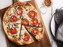 Pizza With Pesto Fresh Tomatoes And Mozzarella Recipe Epicurious Com Recipes Sweet Potato Recipes Pizza Recipes