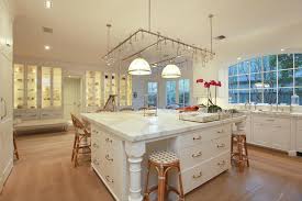 Granite is the sum of minerals within it: Oversized Kitchen Island Transitional Kitchen Cote De Texas