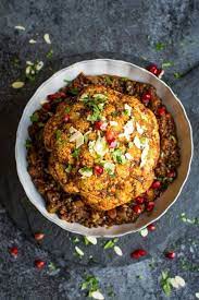 Baked Cauliflower With Spicy Lentils 11 Delicious Vegan Christmas Recipes That Even Carn Vegan Christmas Dinner Christmas Food Dinner Vegan Christmas Recipes