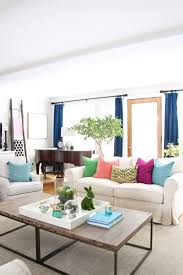 To get the look, layer a striped tablecloth with plain white plates and colorful napkins. Easy Easter Decorating With Bright Cheerful Spring Colors