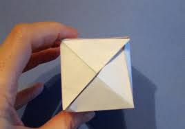 The first step is to fold the cards into pieces suitable for assembling into a cube: Rubber Band Pop Up Cube Rubber Bands Paper Pop Up Paper Pop