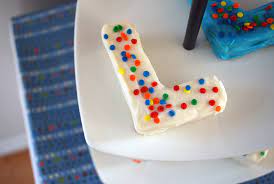 Order alphabet name cake for birthday anniversary or all occasions and get same day. Letter Mini Birthday Cakes Petit Fours Merriment Design