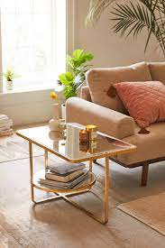 Flat tabletop with rounded corners in a natural finish. Urban Outfitters Geneva Mirrored Coffee Table