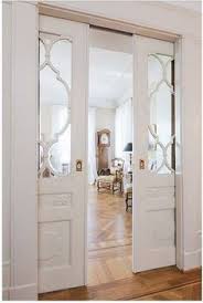 A solid wood credenza coordinates with a dining table that has the same finish, while one with glass doors keeps your formal dishes on display. 23 Dining Room Door Solution Ideas Room Doors Dining Room Dining