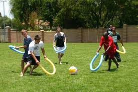 Teams Play A Kind Of Hockey Where You Could Only Hit A Beach Ball With Pool Noodles Youth Group Games Outdoor Games Youth Games