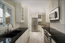 The interesting element in this backsplash is the choice of a wooden look, instead of a traditional tile. White Kitchen Backsplash Tile Beveled Arabesque Kitchen Wall Decor