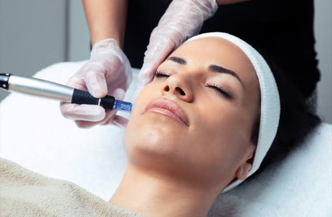 Beautician performing a rejuvenating facial