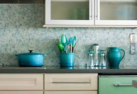 A chic contemporary kitchen with green fish scale tiles that cover the whole wall and give the space a pattern and color. 1001 Ideas For Stylish Subway Tile Kitchen Backsplash Designs
