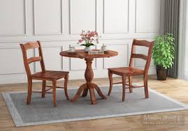 ??upgrade upholstered cushion?this dining table includes 1 dining table and 2 upholstered dining chairs, the contemporary faux leather our wood dining set mix a contemporary design with classic comfort, this kitchen table will look great in your kitchen or dining room. Buy Clove 2 Seater Dining Set Honey Finish Online In India Wooden Street