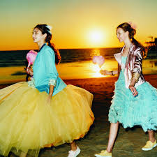 Four female prom goers being photographed. 12 Best Prom Dress Websites To Buy Your Dream Dress In 2020 Teen Vogue