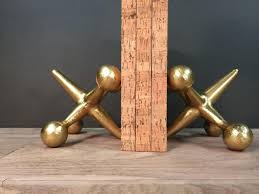 Maybe you would like to learn more about one of these? Gold Cast Iron Jacks Bookends Paperweights Jax Mid Century Modern Style Decor 1874638350