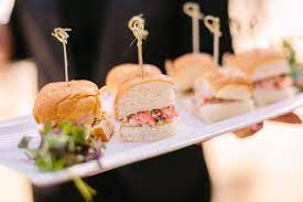 Instead of sit down dinner or buffet, have waiters walk around offering guests heavy horderves. Wedding Reception Food How Many Hors D Oeuvre Per Person Do You