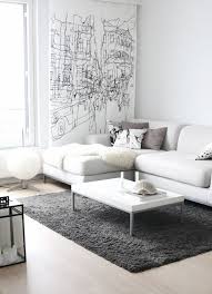 The orange room sets a positive mood, makes one cozy up and encourages bonding over meals. Modern White And Grey Interior Design