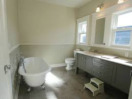 Source Jas Design Build Chic Bathroom With Tan Walls Paired With Gray Subway Tile Backsplash Paired W Grey Bathroom Floor Grey Bathroom Cabinets Grey Tiles