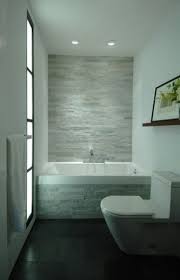White Brick Wall And Modern Bath Tubs With Dark Floor In Small Bathroom Tiles Decorating Gorgeous Bathroom Designs Small Bathroom Remodel Small Bathroom Tiles