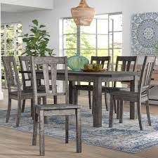 A dining table, seating, and a storage/display. Mistana Katarina Extendable Rubberwood Solid Wood Dining Set Reviews Wayfair