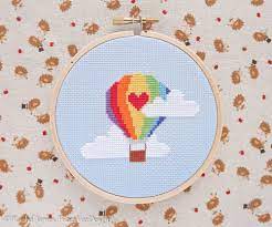 Free counted cross stitch patterns are easy to save and print out for use in creating lovely home decorations and gifts. Rainbow Hot Air Balloon Cross Stitch Pattern Pdf Etsy Stitch Patterns Modern Cross Stitch Patterns Cross Stitch