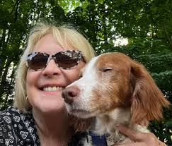 Petite woman maneuvering a 70 lb bike into an SUV alone