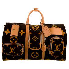 The duffel bag, or weekender, is perfect for carrying clothing and small mens toiletry bags inside. Louis Vuitton New Virgil Brown Gold Travel Weekender Men S Women S Duffle Bag At 1stdibs