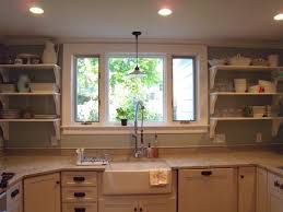 Or, do a sconce over the window. Image Kitchen Window Sink Decorpad