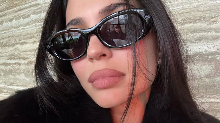 Kylie Jenner wearing the new Meta Starfire smart glasses., AI generated