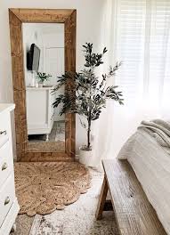 Mirror is one material/object that can provide a lot of benefits at once in a bedroom. Diy Wood Floor Mirror And Faux Olive Tree Diy Wood Floors Floor Mirror Decor Floor Mirror