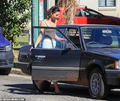 Vanessa Valladares visits a wellness store in Byron Bay before driving off  in a very old car