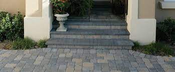 A porch is attached to the front of the main structure. See For Yourself How Pavestone S Pavers Patio Stones Retaining Wall Blocks Edging And Landscape Access Front Porch Stone Steps Paver Steps Front Porch Steps