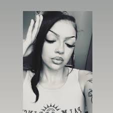 Is anyone missing a small white dog with brown spots in Joplin, Missouri?