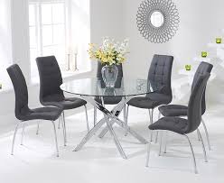 Glass dining tables designs include the cross metal and glass dining table which can be ordered with tinted glass table tops. Mark Harris Daytona Glass Round Large Dining Table And 4 California Chairs Chrome And Grey Cfs Furniture Uk