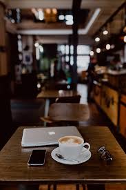 Find coffee wallpaper awesome wallpapers every week on. Hd Wallpaper Cup Of Coffee On Table In Cafe Interior Tech Technology Work Wallpaper Flare