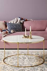 Brass finished metal legs and the faux marble veneer table top. Leavenworth Marble Coffee Table Anthropologie