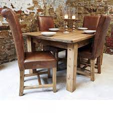 Earth pair of dining chairs. Haddon Plank Dining Table Leather Chairs From Curiosity Interiors
