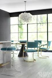 Jonathan adler modern homage to an empire style rider upholstered dining chair. Black And Gold Dining Table With Turquoise Dining Chairs Contemporary Kitchen