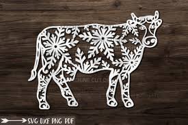 ✓ free for commercial use ✓ high quality images. Christmas Cow With Snowflakes Paper Cut Graphic By Cornelia Creative Fabrica