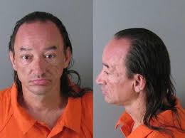 Police: Man hit woman, kicked 3 officers