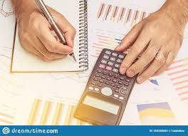Business Man Using Calculator Analyzing Investment Chart On