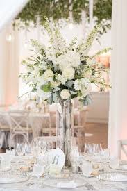 Tall Table Center Piece With White Flowers And Greenery Elegant And Stunning Photo By T Tall Wedding Centerpieces Wedding Table Centres Wedding Table Flowers