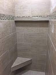 Master Bath Shower In 12x24 Porcelain Tile Installed At A 1 3 Staggered With A Floating Cor Master Bath Shower Bathroom Remodel Shower Master Bathroom Shower